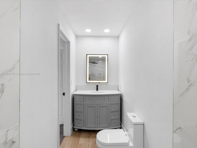 bathroom with vanity and toilet