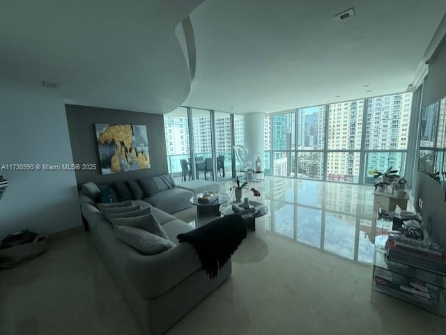 1331 Brickell Bay Dr Unit 1602, Miami, FL 33131 - living room featuring plenty of natural light and a wall of windows