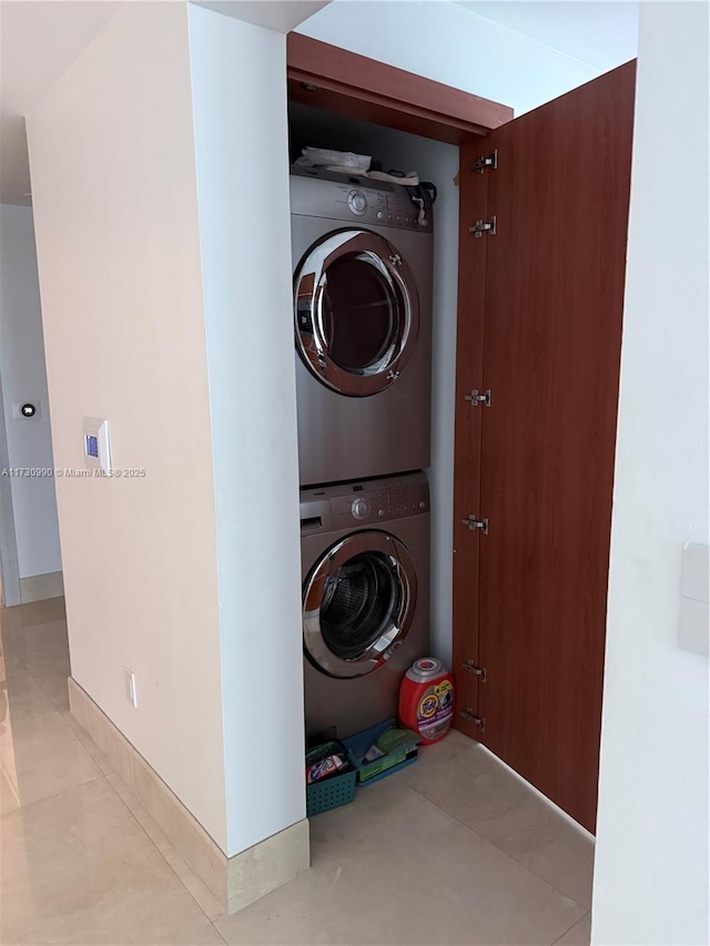 1331 Brickell Bay Dr Unit 1602, Miami, FL 33131 - laundry room featuring stacked washer / drying machine and tile patterned flooring
