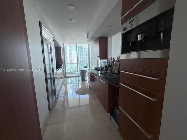 1331 Brickell Bay Dr Unit 1602, Miami, FL 33131 - kitchen with a wall of windows and modern cabinets