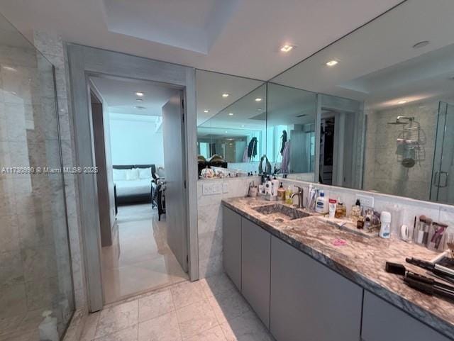 1331 Brickell Bay Dr Unit 1602, Miami, FL 33131 - bathroom featuring a stall shower, double vanity, and recessed lighting