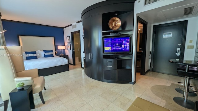 tiled bedroom featuring ornamental molding