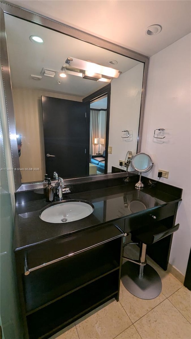 bathroom with tile patterned floors and vanity