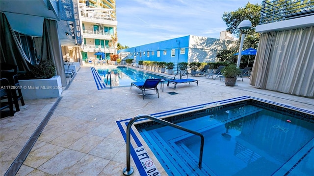 view of swimming pool featuring a patio