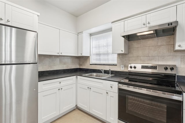 kitchen with backsplash, sink, white cabinetry, and appliances with stainless steel finishes