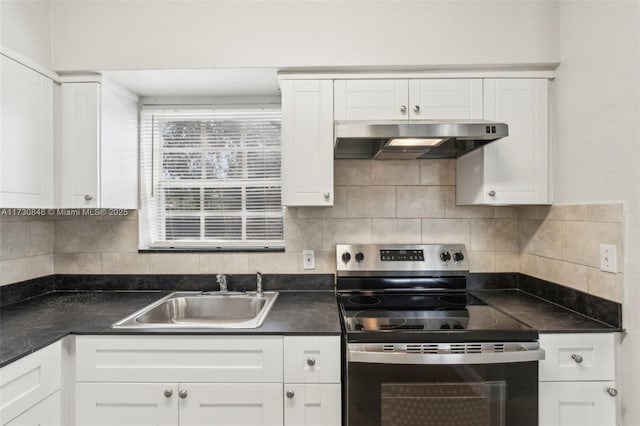 kitchen with white cabinets, sink, decorative backsplash, and stainless steel electric stove