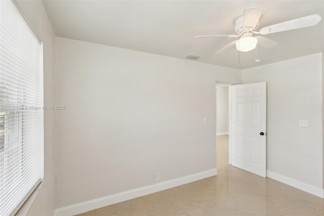 spare room with ceiling fan