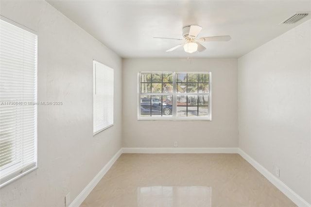 empty room featuring ceiling fan