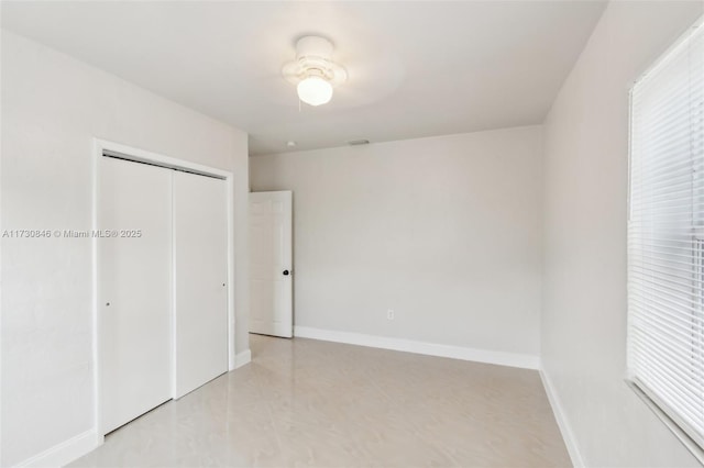 unfurnished bedroom with a closet and ceiling fan