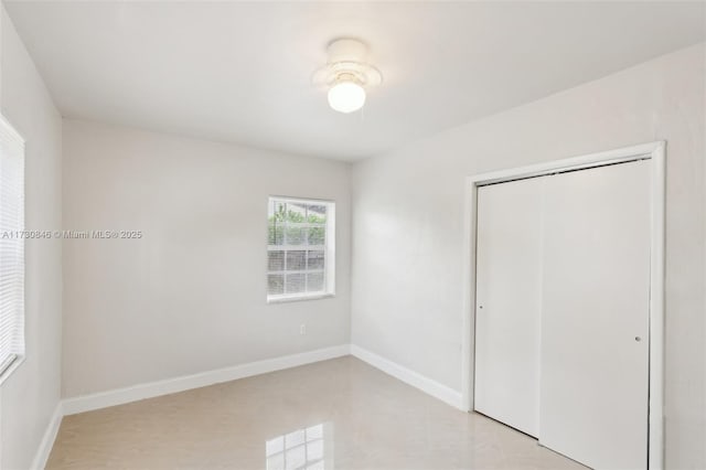 unfurnished bedroom with a closet