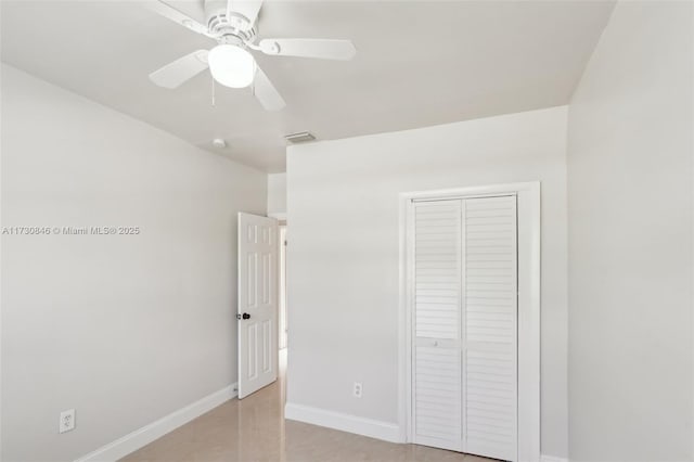 unfurnished bedroom featuring a closet and ceiling fan