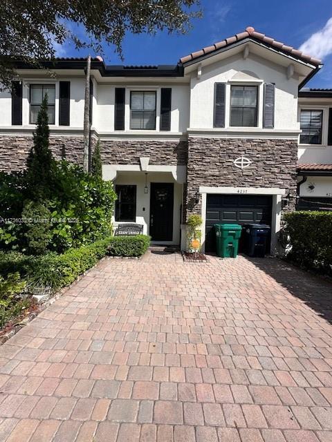 view of front of property featuring a garage