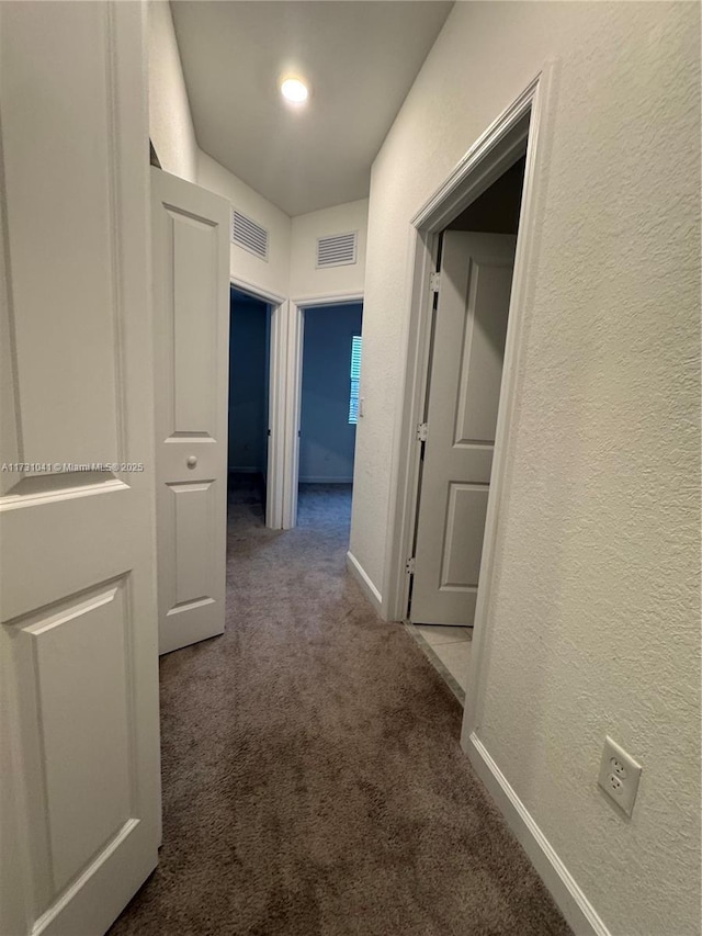 hallway with carpet