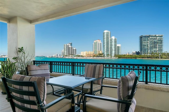 balcony featuring a water view