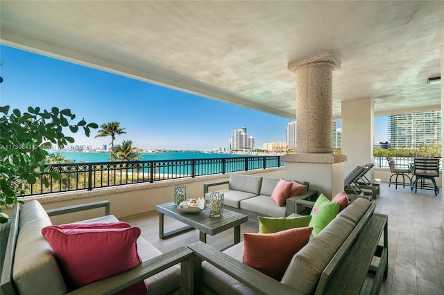 view of patio featuring an outdoor living space and a water view