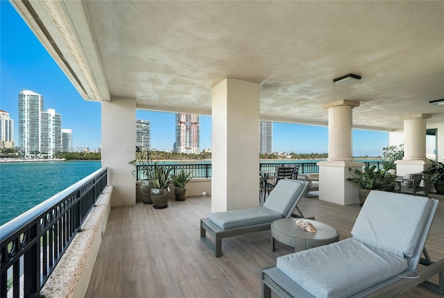 balcony featuring a water view