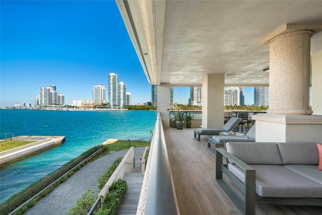 balcony featuring a water view