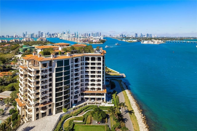 aerial view featuring a water view and a beach view