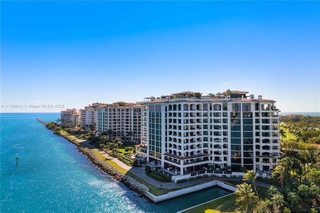 drone / aerial view with a beach view and a water view