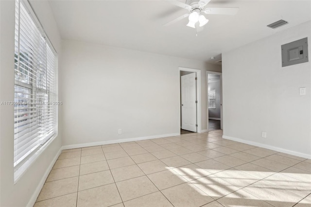 unfurnished room featuring ceiling fan and light tile patterned floors