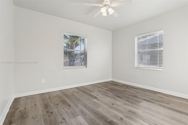 empty room featuring light hardwood / wood-style floors and ceiling fan