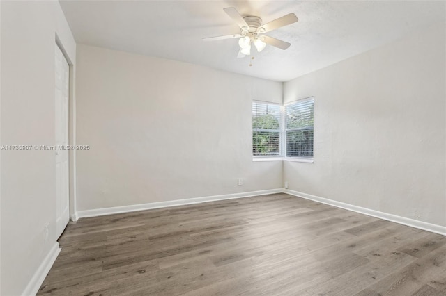 unfurnished room featuring hardwood / wood-style flooring and ceiling fan