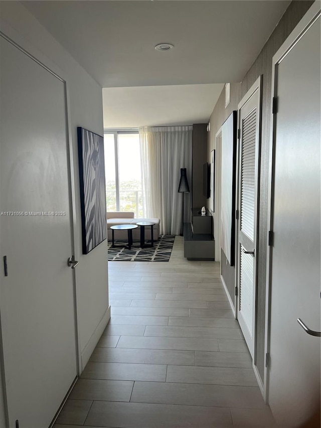 corridor featuring light hardwood / wood-style floors