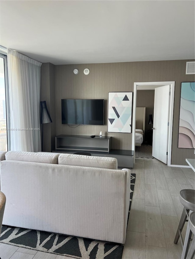 living room with light hardwood / wood-style flooring