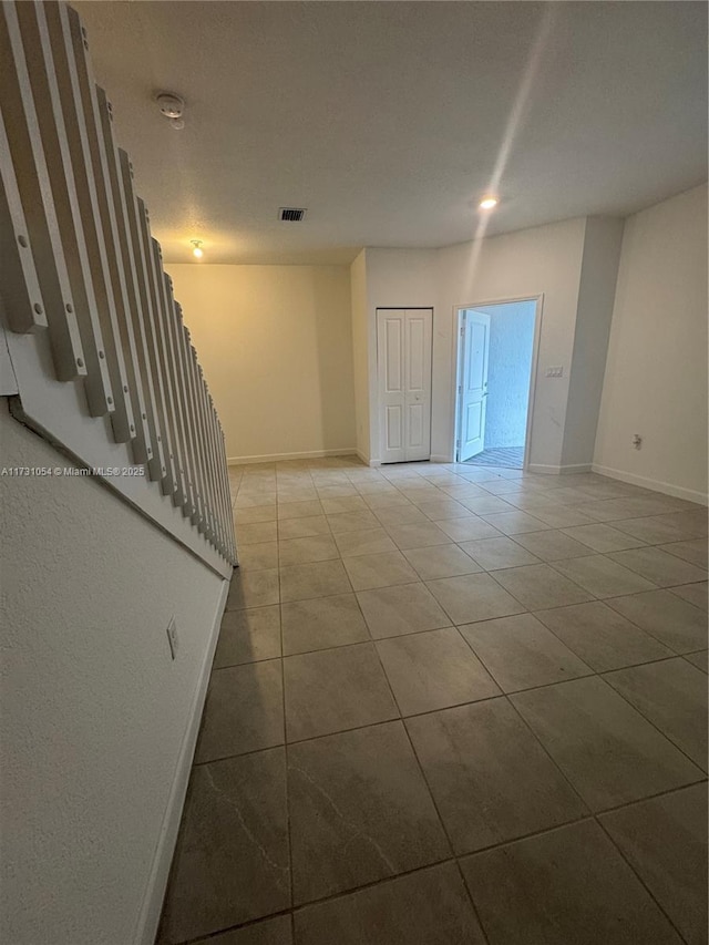 view of tiled spare room