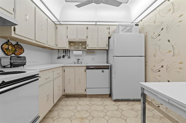 kitchen featuring sink, white appliances, and ceiling fan