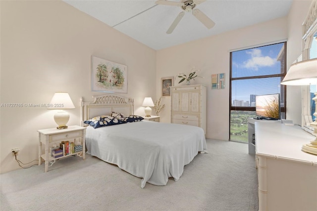 bedroom featuring ceiling fan and carpet