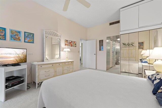 bathroom with vanity, toilet, tile walls, and tile patterned flooring