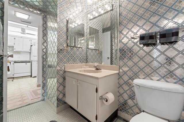 bathroom featuring tile patterned floors, walk in shower, and toilet