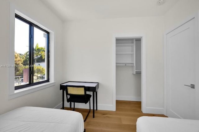 bedroom featuring hardwood / wood-style flooring and a closet