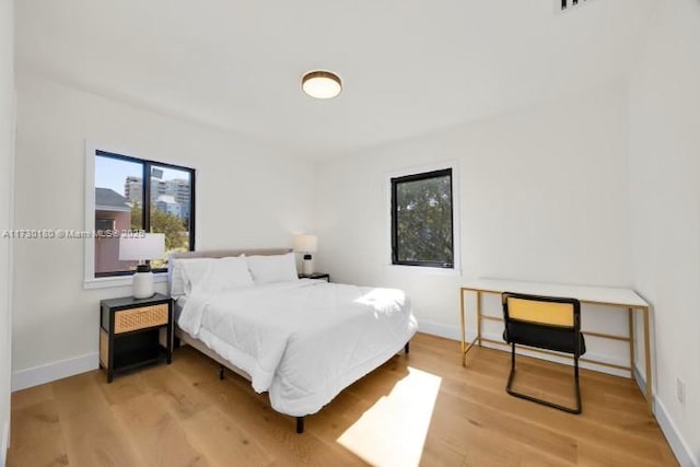 bedroom featuring light wood-type flooring