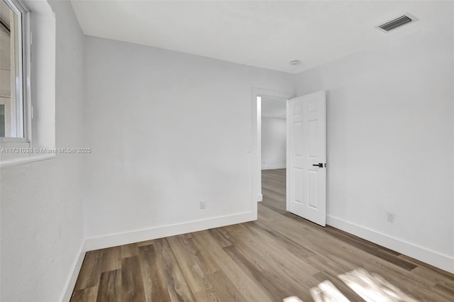 spare room with light hardwood / wood-style flooring