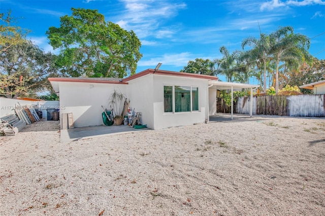 back of property featuring a patio area