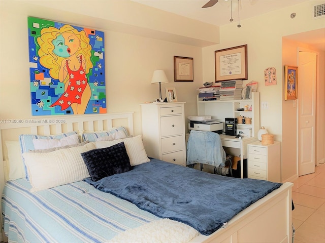 bedroom with ceiling fan and light tile patterned flooring