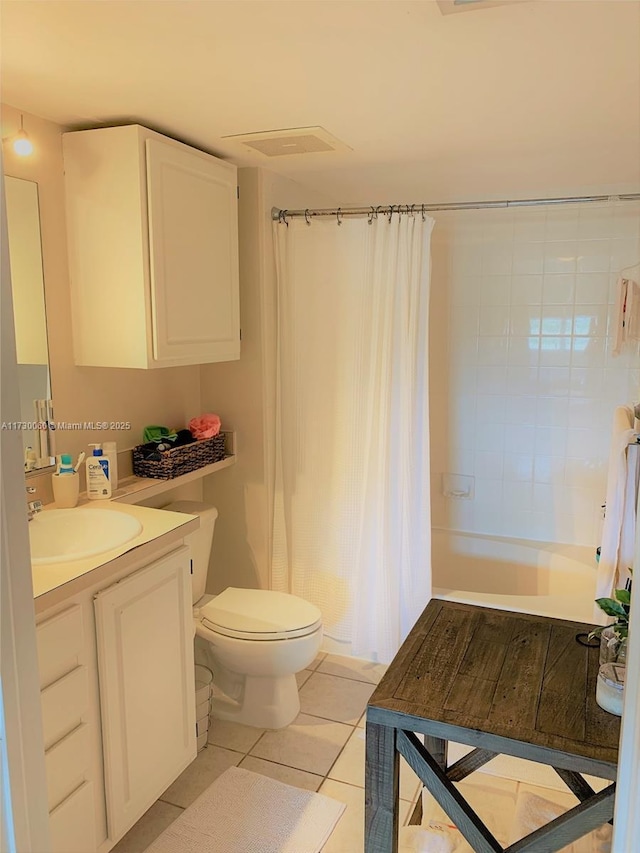 full bathroom with tile patterned floors, vanity, toilet, and shower / tub combo with curtain