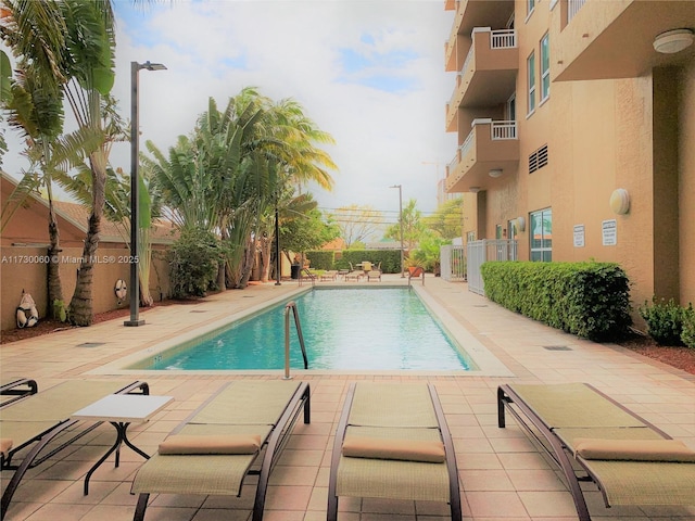 pool with a patio