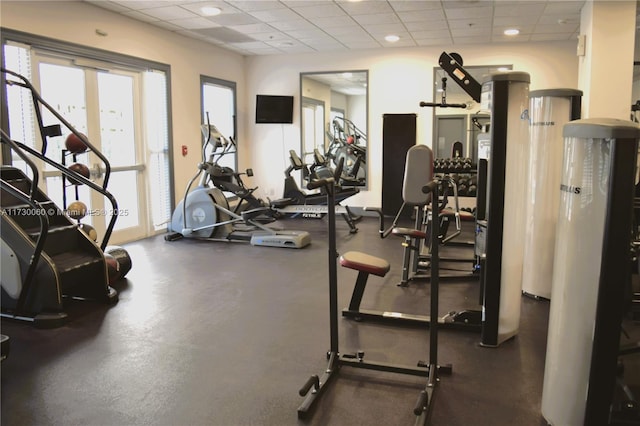 exercise room featuring a paneled ceiling