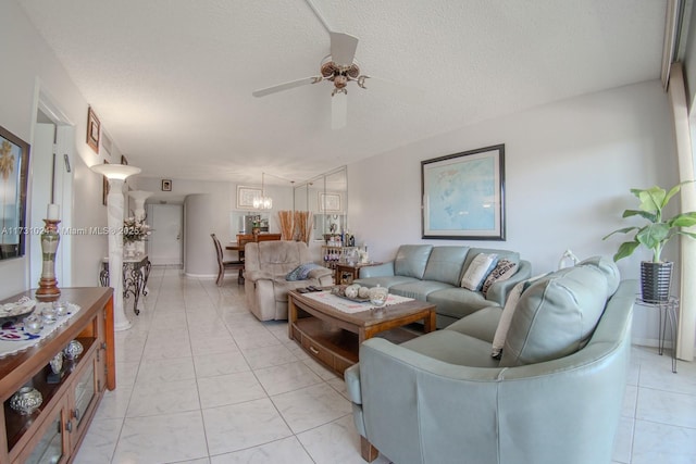 living room featuring a textured ceiling and ceiling fan