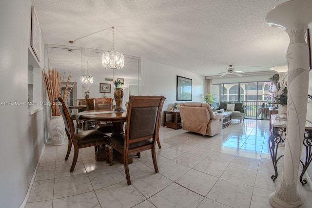 dining area with ceiling fan with notable chandelier and a textured ceiling