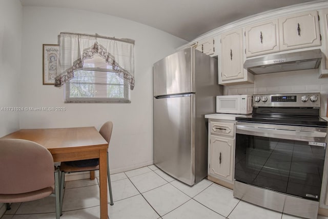 kitchen featuring white cabinetry, light tile patterned floors, and appliances with stainless steel finishes