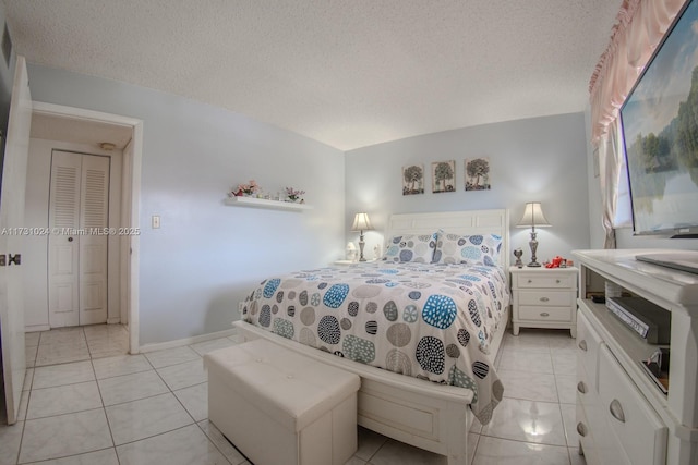 tiled bedroom with a textured ceiling