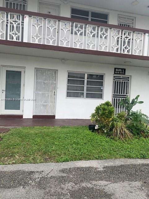 property entrance with a balcony