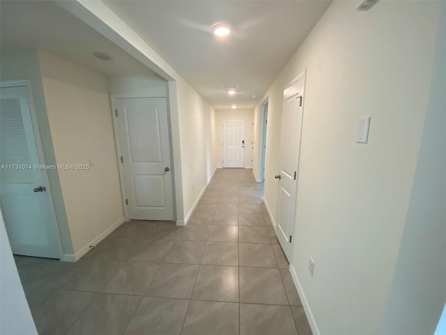 hallway with light tile patterned floors