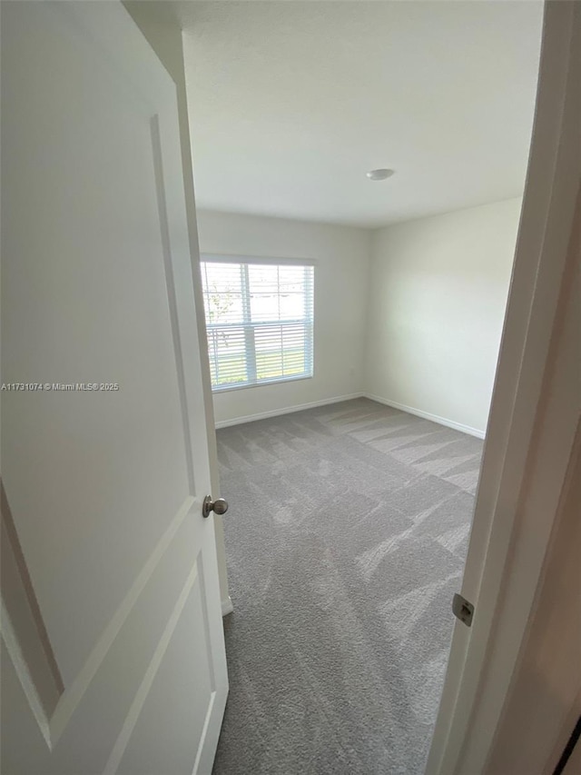 empty room with carpet flooring