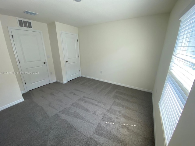 unfurnished bedroom featuring carpet flooring