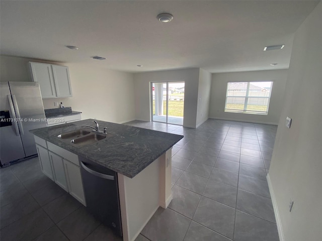 kitchen featuring white cabinetry, black dishwasher, sink, stainless steel fridge with ice dispenser, and a center island with sink